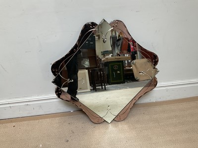 Lot 1221 - An Art Deco peach and clear glass wall mirror...