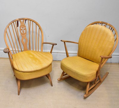 Lot 1222 - ERCOL; a spindle back elbow chair and similar...