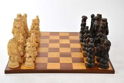 Lot 1478 - A modern resin chess set with board.