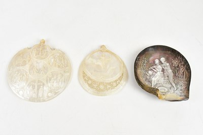 Lot 1493 - Three mother of pearl carved shells, including...