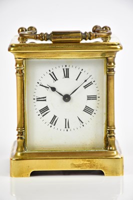 Lot 709 - A brass cased carriage clock with white enamel...