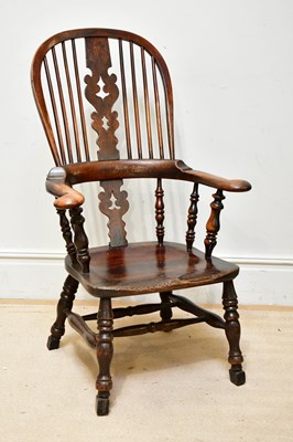 Lot 1056 - A Victorian Windsor type elbow chair, with elm...