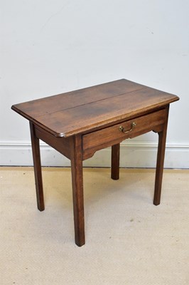 Lot 1111 - A Georgian oak single drawer side table on...