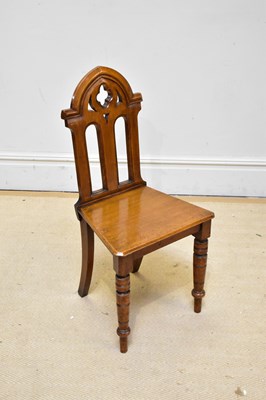 Lot 1112 - A late Victorian Gothic oak hall chair on ring...