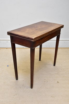 Lot 1089 - A 19th century oak fold-over tea table on...