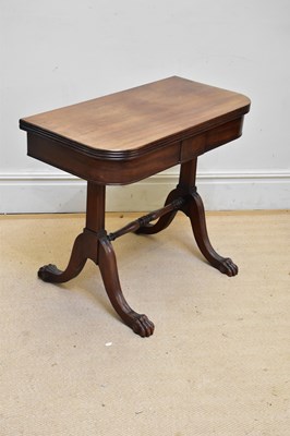 Lot 1067 - A 19th century mahogany fold-over tea table,...