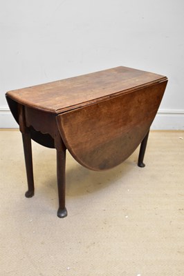 Lot 1095 - A 19th century oak drop-leaf table, height...