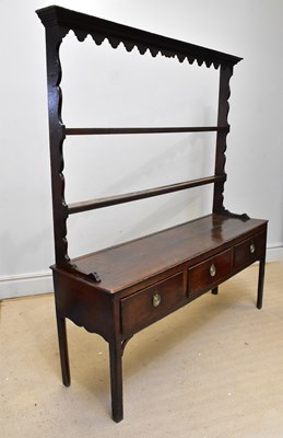 Lot 1006 - A late 18th century oak three drawer open...
