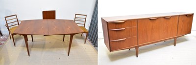 Lot 1216 - A mid century teak dining suite comprising...