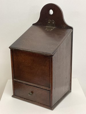 Lot 58 - An early 19th century oak candle box with...