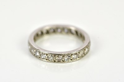 Lot 106 - A white metal full eternity ring set with...