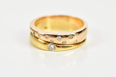 Lot 67 - An 18ct yellow gold ring set with nine round...