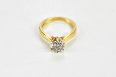 Lot 31 - An 18ct yellow gold diamond solitaire ring,...