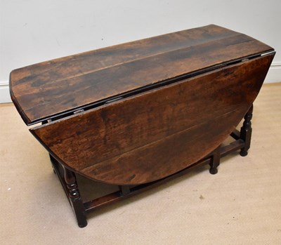 Lot 89 - A 17th century oak drop-leaf gateleg dining...