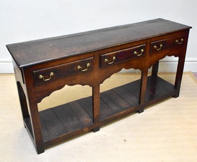 Lot 1143 - An 18th century oak dresser base with three...