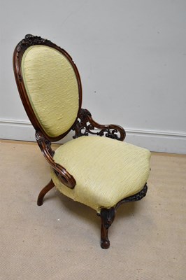 Lot 1100 - A Victorian carved walnut spoon back chair.