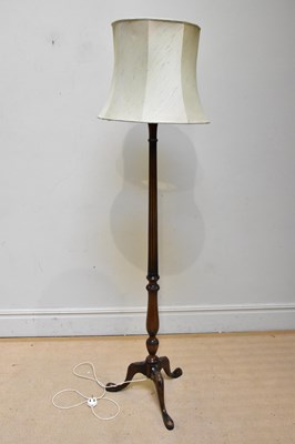 Lot 1102 - A reproduction mahogany standard lamp with...