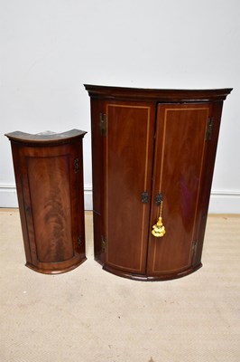 Lot 1063 - A 19th century inlaid mahogany bowfront...