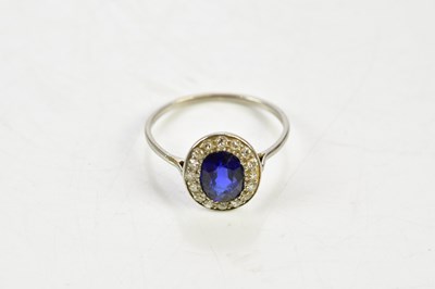 Lot 45 - A white metal sapphire and diamond oval...