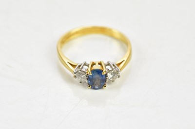 Lot 72 - An 18ct yellow gold diamond and sapphire ring,...