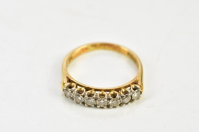 Lot 73 - An 18ct yellow gold seven stone diamond half...