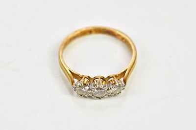 Lot 109 - An 18ct yellow gold three stone diamond ring,...