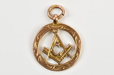 Lot 17 - A Masonic 9ct gold pierced circular pendant,...