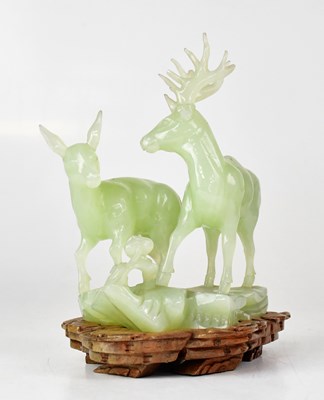 Lot 323 - A green jade figure group of a stag and doe,...