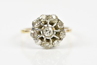 Lot 141 - A yellow metal diamond set open target ring,...