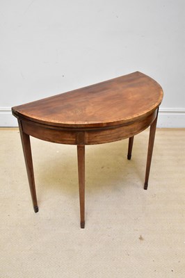 Lot 1104 - A 19th century mahogany demi-lune fold-over...
