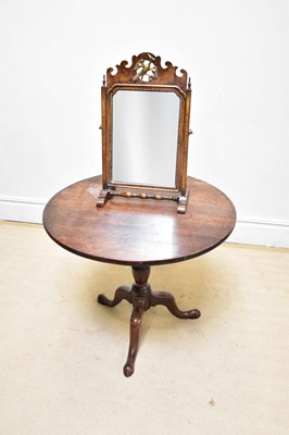 Lot 1073 - A 19th century mahogany tilt-top tripod table...