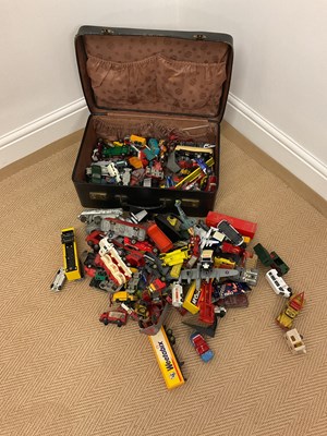 Lot 91 - A vintage suitcase containing playworn diecast...