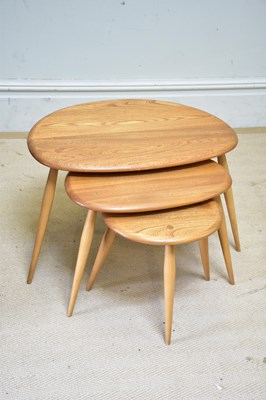 Lot 14 - ERCOL; a nest of three Pebble tables, largest...