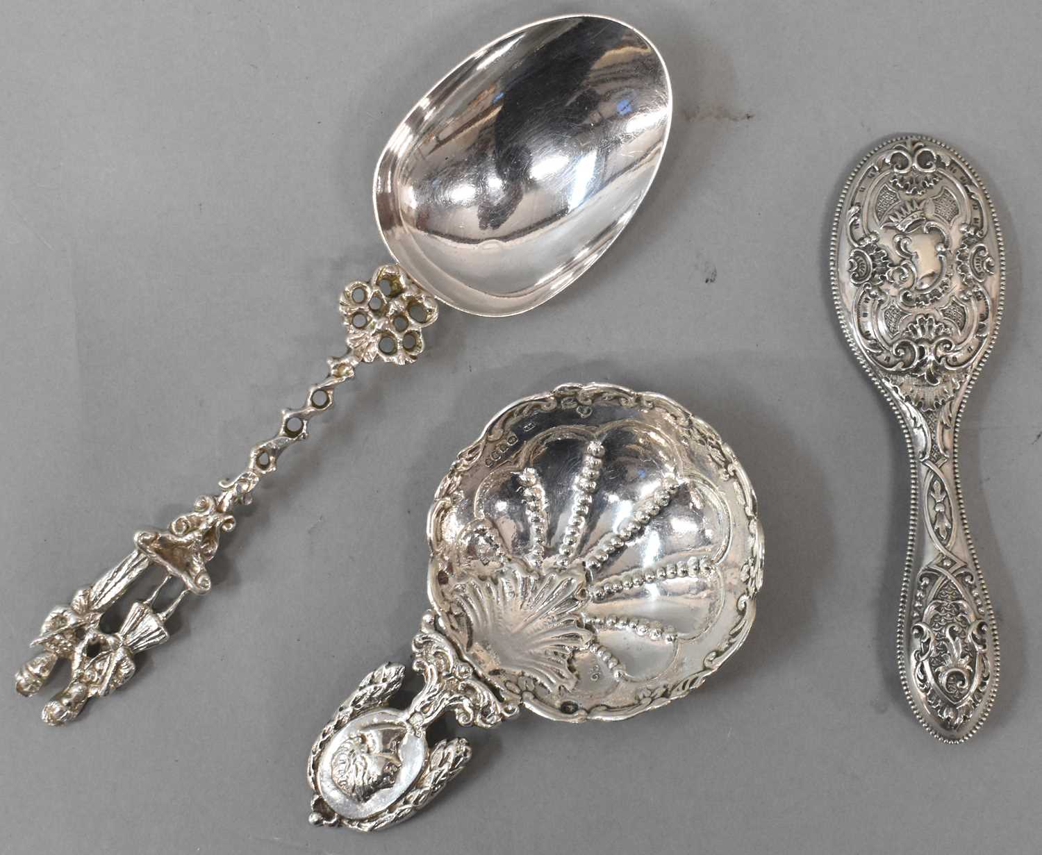 Lot 707 - A Dutch silver serving spoon, a pin dish with...