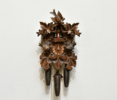 Lot 1317 - A Black Forest cuckoo clock, with bird...