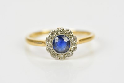 Lot 162 - An 18ct yellow gold platinum tipped sapphire...