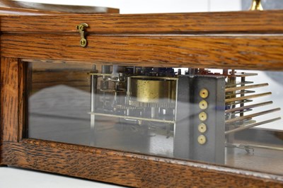 Lot 1307 - COMITTI; a modern oak eight day wall clock,...