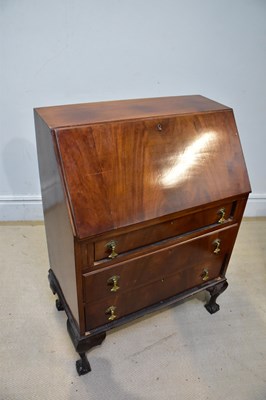 Lot 197 - A 1950s mahogany bureau, with fall front above...