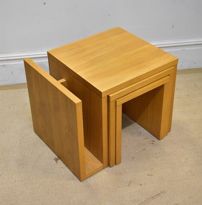 Lot 69 - A modern oak nest of three graduated tables,...