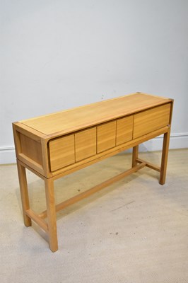 Lot 65 - A modern three drawer hall table, on block...