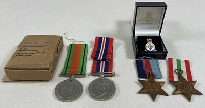 Lot 116 - A WWII medal group and Veteran badge,...