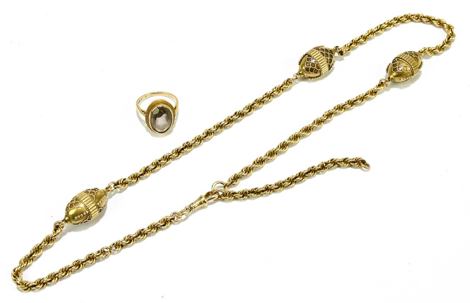 Lot 1384 - A 15ct yellow gold rope link chain set with...