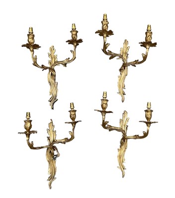 Lot 166 - Two pairs of French gilt metal two branch wall...