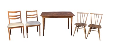 Lot 52 - G PLAN; a mid century teak extending dining...