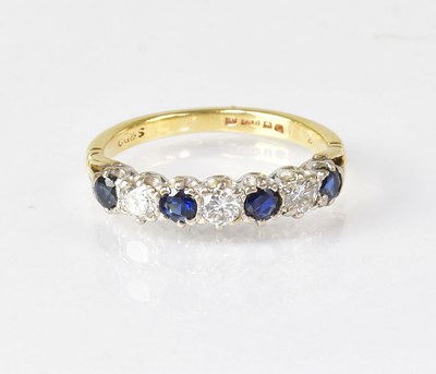 Lot 606 - An 18ct diamond and sapphire five-stone ring,...