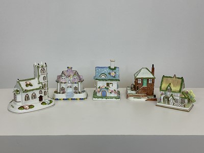 Lot 199 - COALPORT; four porcelain models of buildings,...