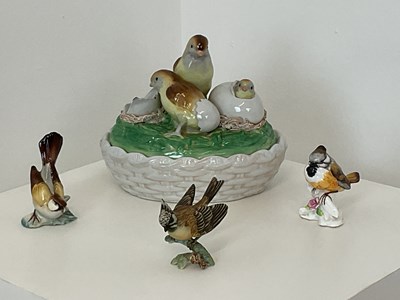 Lot 200 - An early 20th century hand painted ceramic egg...