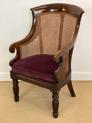 Lot 790 - A 19th century mahogany bergere library chair,...