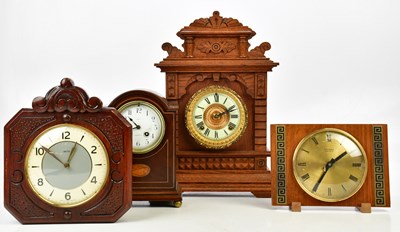 Lot 1338 - An Edwardian inlaid mahogany mantel clock, the...
