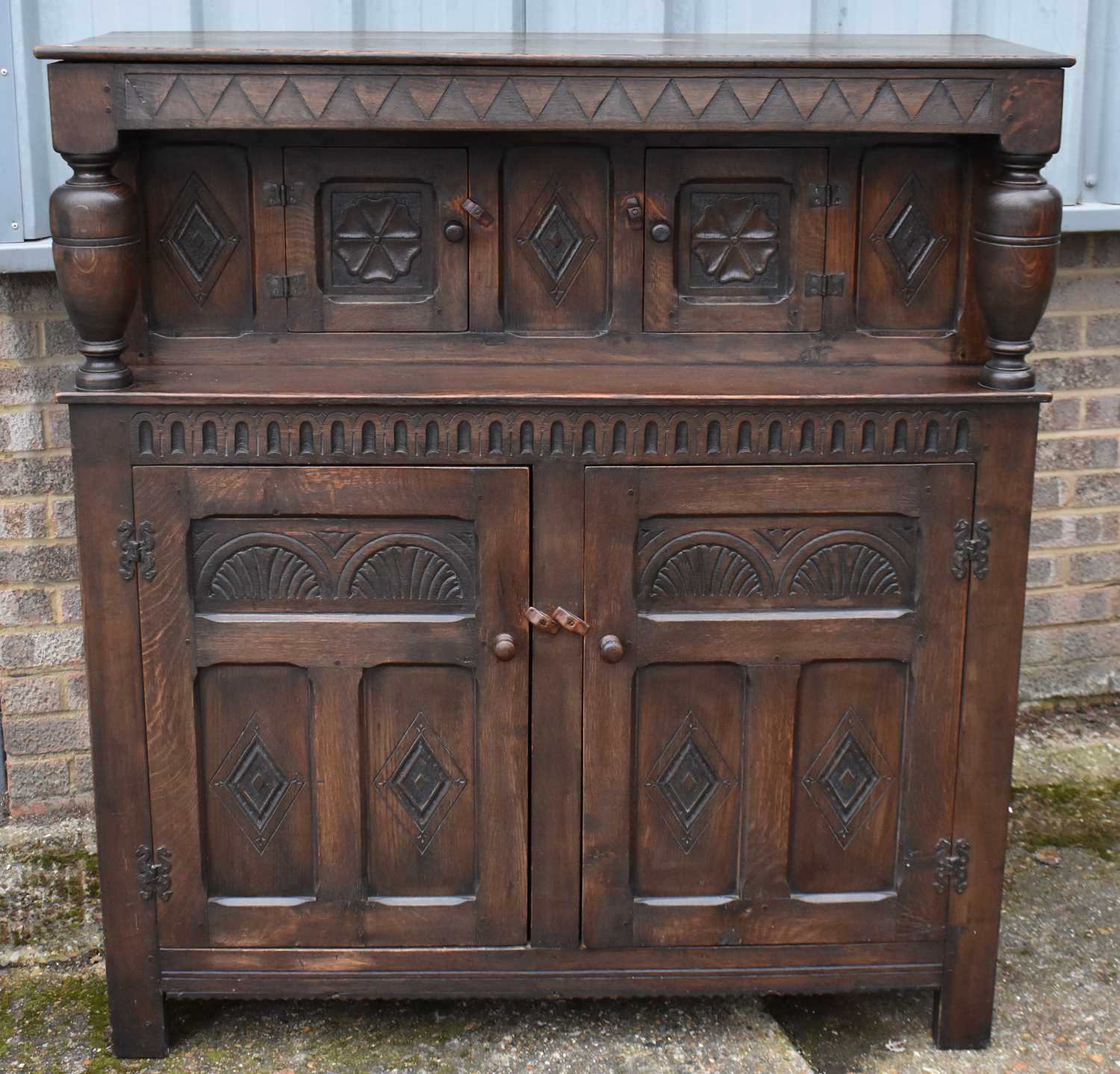 Lot 51 A reproduction oak court cupboard, with two